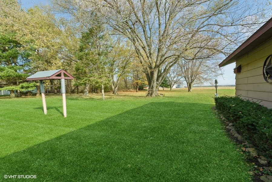 6002 Pine Street Harvard, IL 60033 - Photo 19 of 21 a view of a house with a backyard