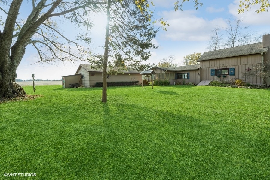 6002 Pine Street Harvard, IL 60033 - Photo 20 of 21 a view of a house with a backyard