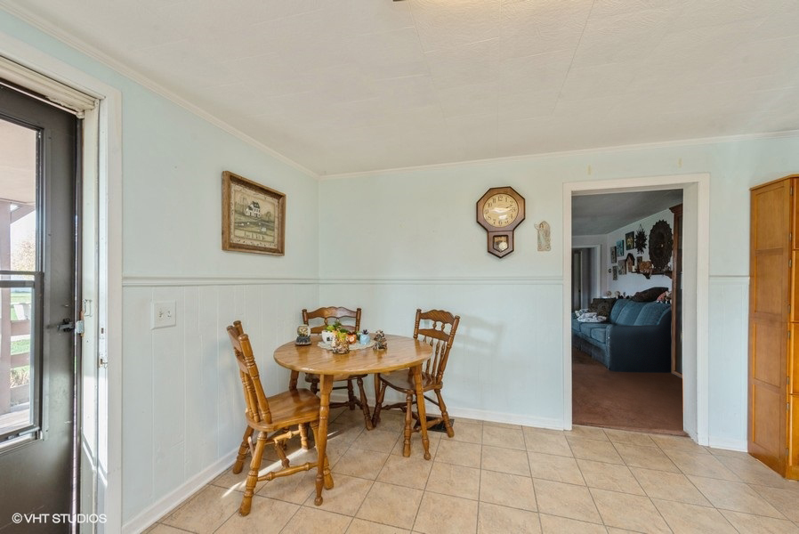 6002 Pine Street Harvard, IL 60033 - Photo 7 of 21 a dining room with furniture and window