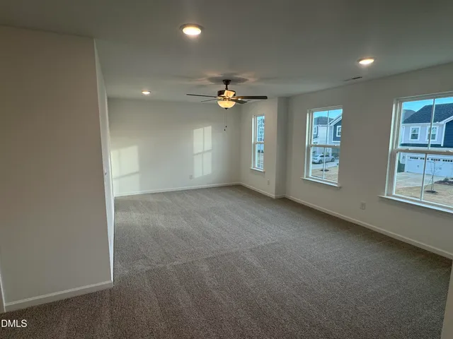 a bathroom with a sink a toilet a mirror and shower
