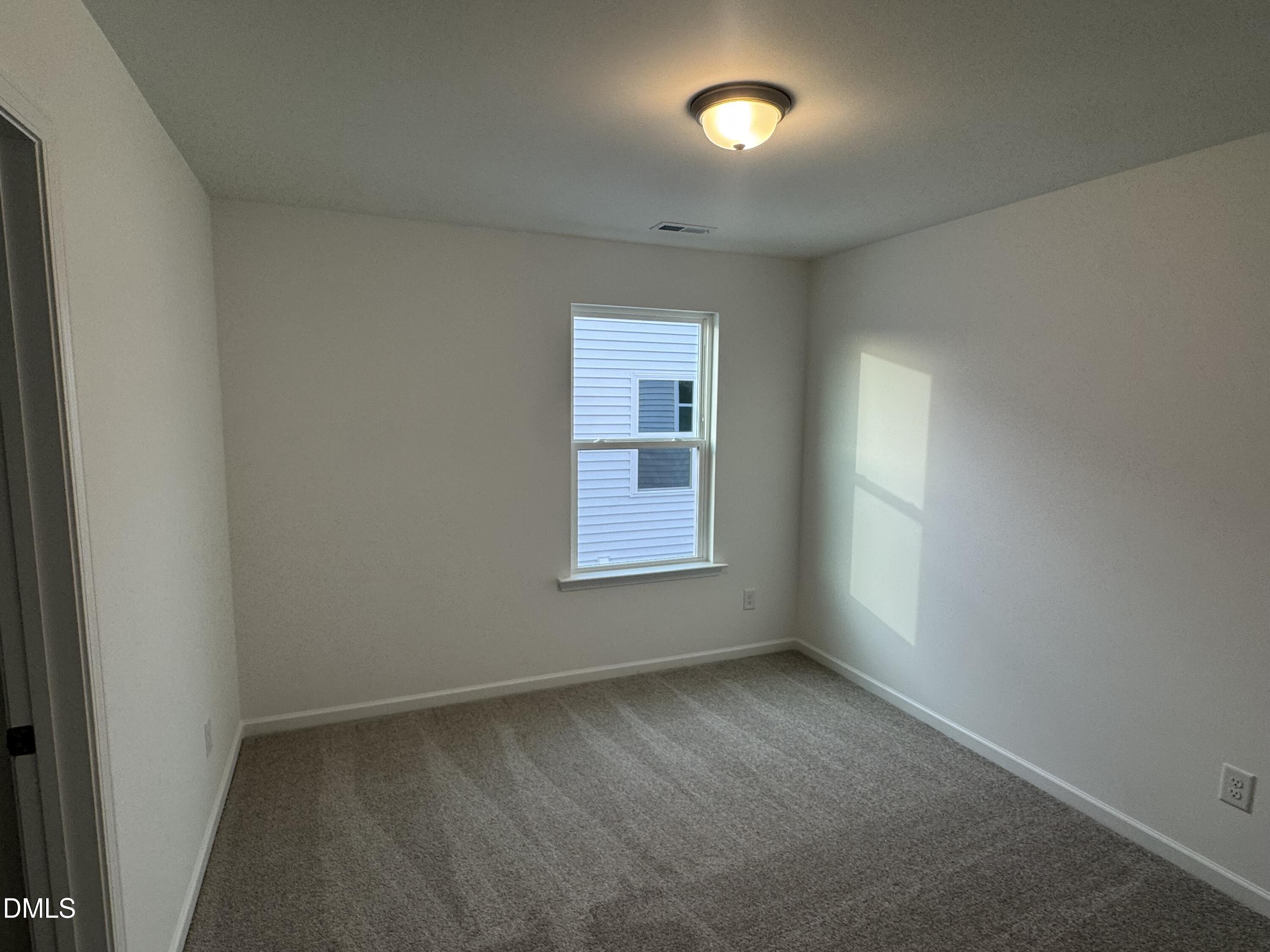 136 Vulcan Street Garner, NC 27529 - Photo 15 of 27 an empty room with a window