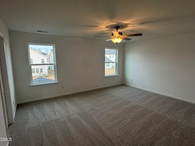 a spacious bathroom with a double vanity sink mirror and shower