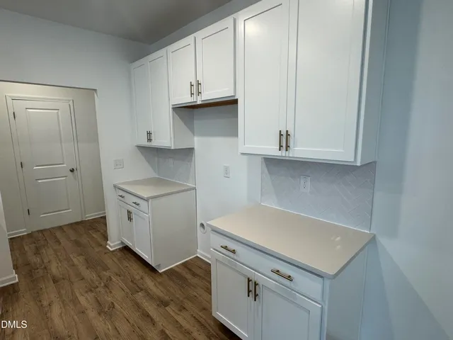 a kitchen with a stove and a microwave
