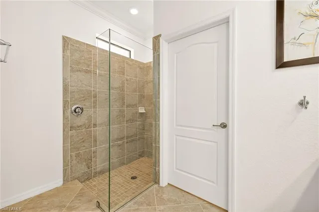 a bathroom with a shower and a sink