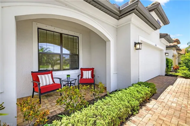 a view of a bench in front of a house