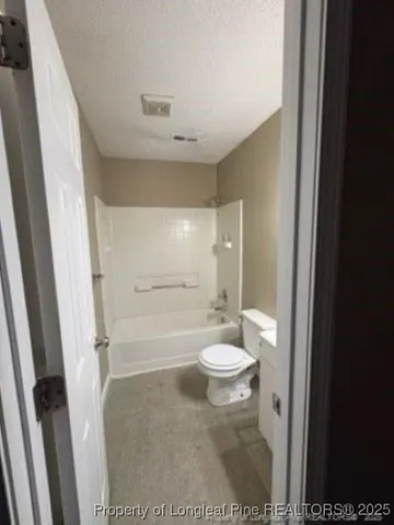 a bathroom with a toilet a sink and a bathtub
