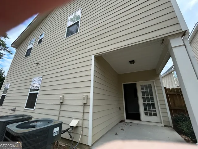 a front view of a house with a garage