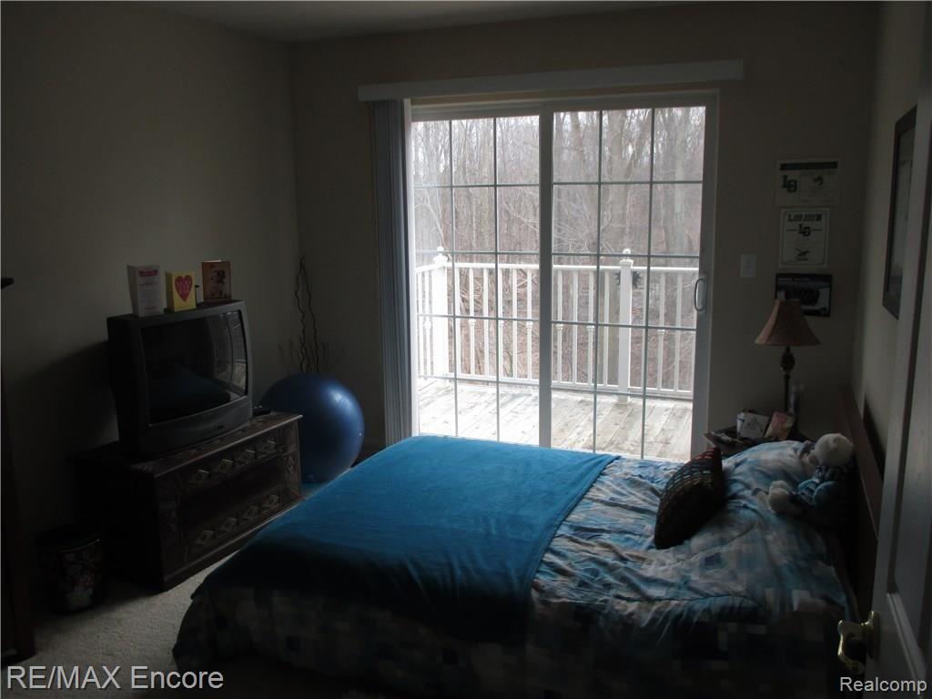 3567 Tremonte Circle, Unit 243 Rochester, MI 48306 - Photo 17 of 23 2nd bedroom with doorwall to balcony