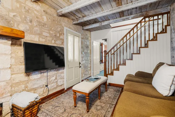 a spacious bedroom with a bed and a table in it