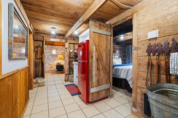 a bedroom with a bed and a chair