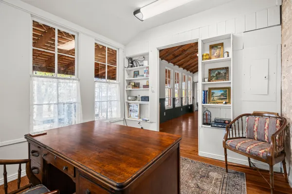 a dining room with furniture and window