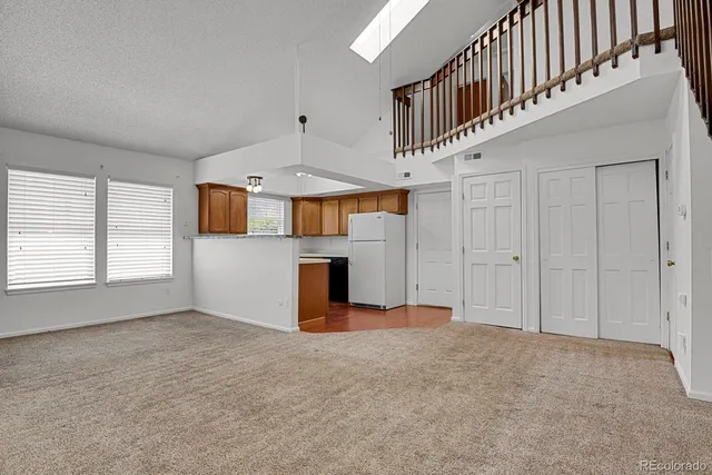 a view of an entryway with a kitchen