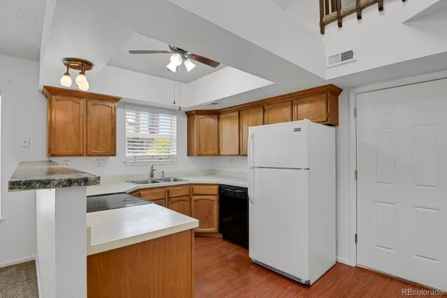 a kitchen with a sink stove and microwave
