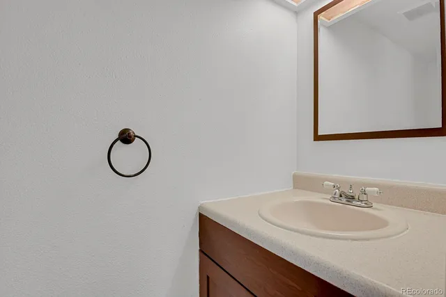 a view of walk in closet with white walls