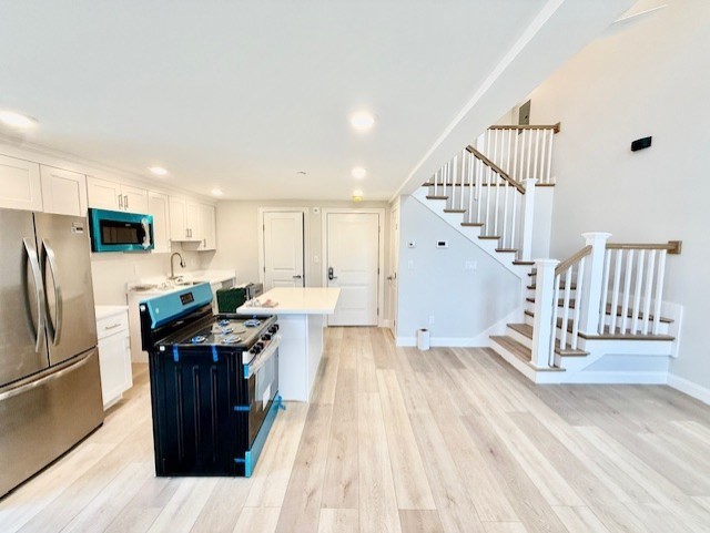 220 Winthrop Street, Unit 206 Winthrop, MA 02152 - Photo 2 of 15 a view of kitchen with sink microwave and refrigerator