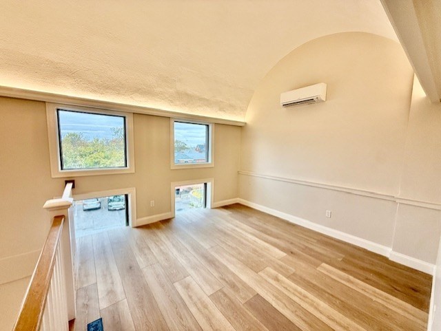 220 Winthrop Street, Unit 206 Winthrop, MA 02152 - Photo 8 of 15 a view of an empty room and wooden floor