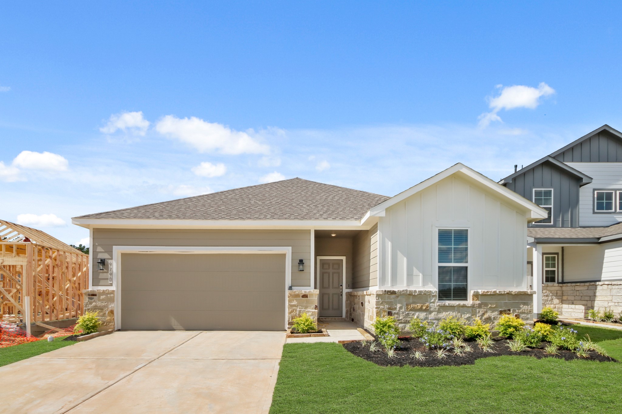 9790 Caney Bend Road Conroe, TX 77303 - Photo 1 of 22 a front view of a house with a yard and garage