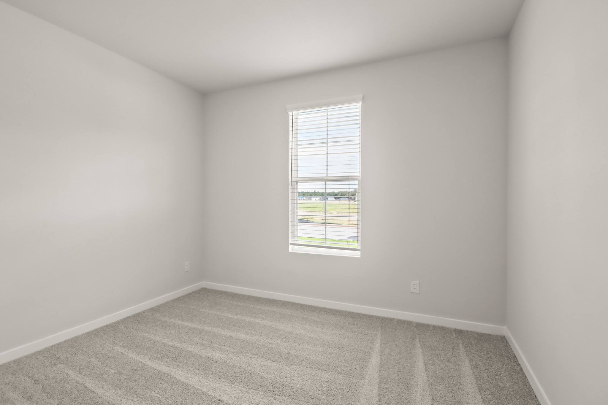 9790 Caney Bend Road Conroe, TX 77303 - Photo 13 of 22 an empty room with a window