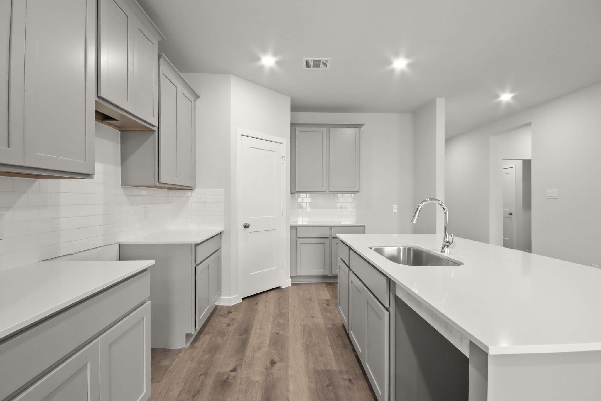 9790 Caney Bend Road Conroe, TX 77303 - Photo 5 of 22 a kitchen with a sink stove and cabinets