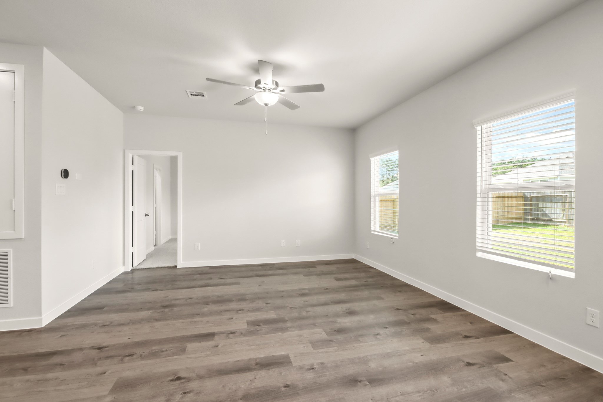 9790 Caney Bend Road Conroe, TX 77303 - Photo 7 of 22 a view of an empty room with a window