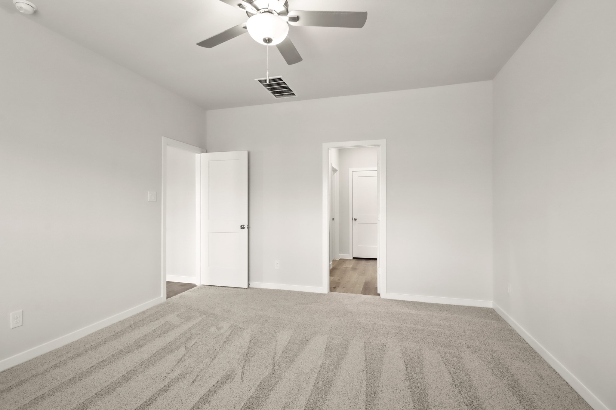 9790 Caney Bend Road Conroe, TX 77303 - Photo 8 of 22 wooden floor in an empty room