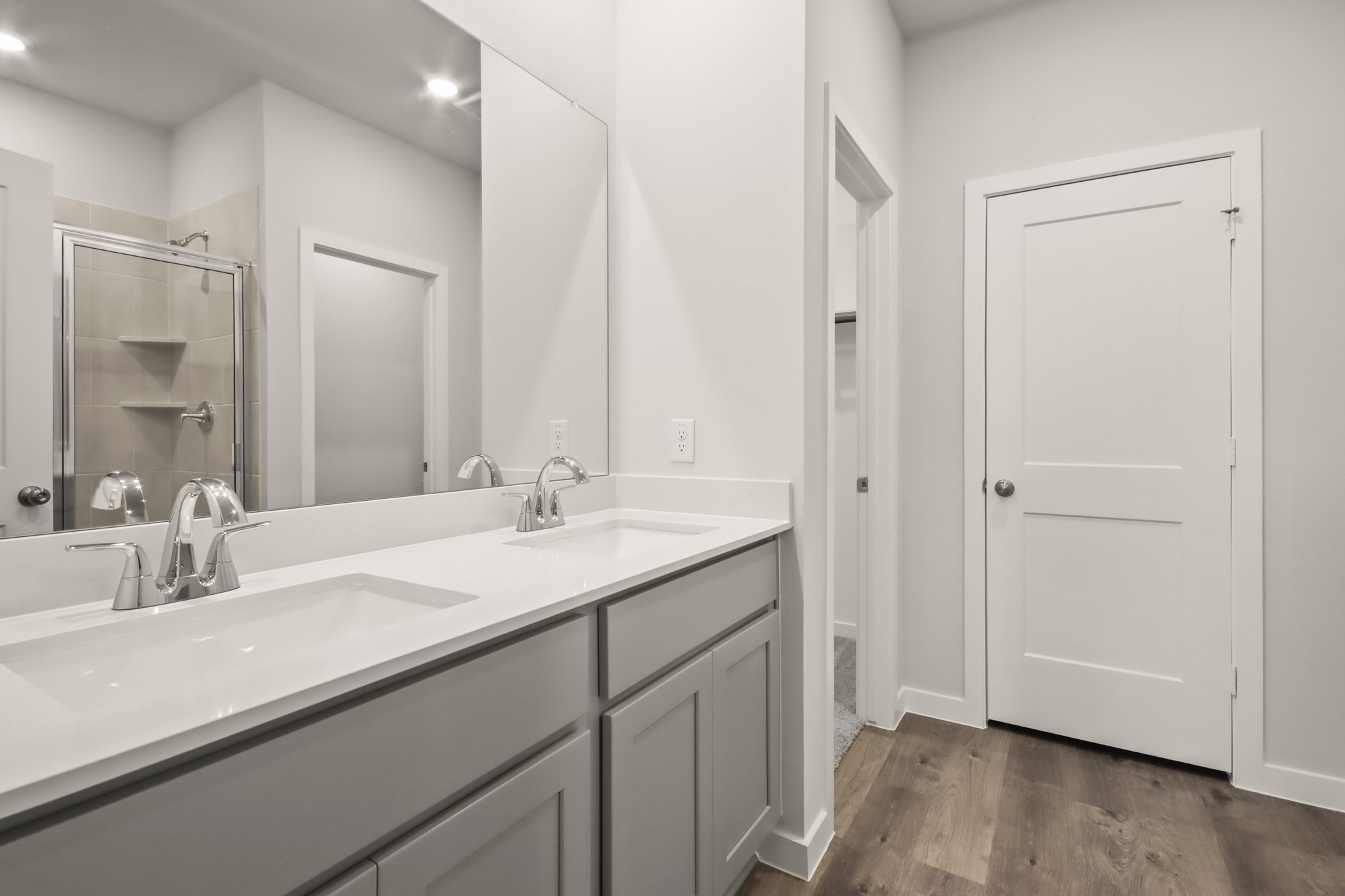 9790 Caney Bend Road Conroe, TX 77303 - Photo 9 of 22 a bathroom with a double vanity sink and mirror