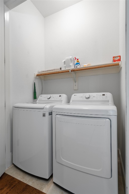 1101 Ivean Pearson Road, Unit E208 Lago Vista, TX 78645 - Photo 25 of 40 a utility room with dryer and washer