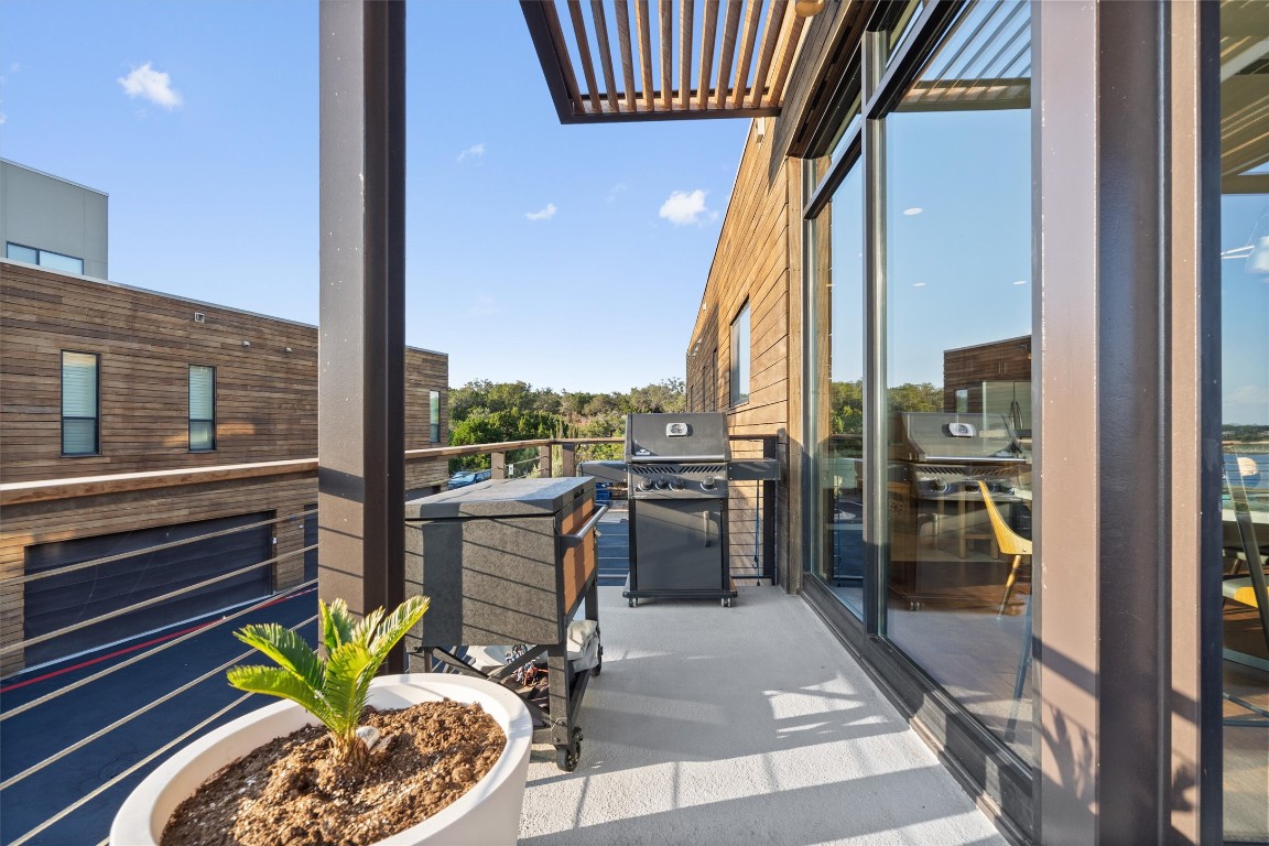 1101 Ivean Pearson Road, Unit E208 Lago Vista, TX 78645 - Photo 29 of 40 a view of a balcony with furniture