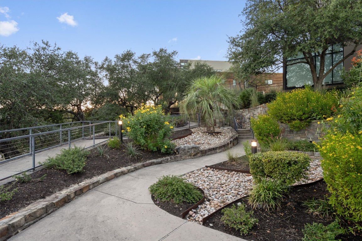1101 Ivean Pearson Road, Unit E208 Lago Vista, TX 78645 - Photo 32 of 40 a view of a garden with a pathway