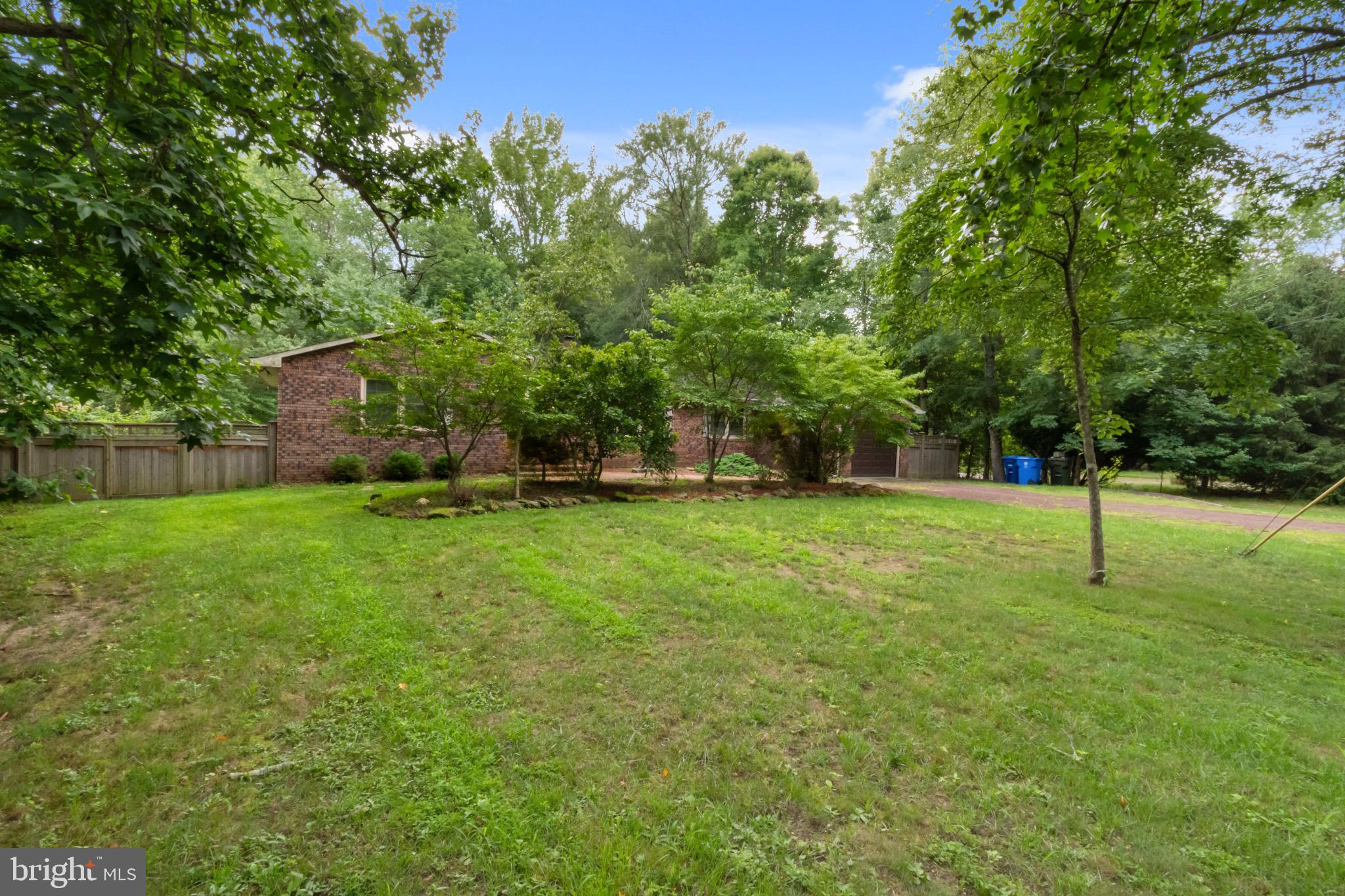 51 Christopher Mill Road Medford, NJ 08055 - Photo 24 of 24 Serene backyard oasis with lush greenery.