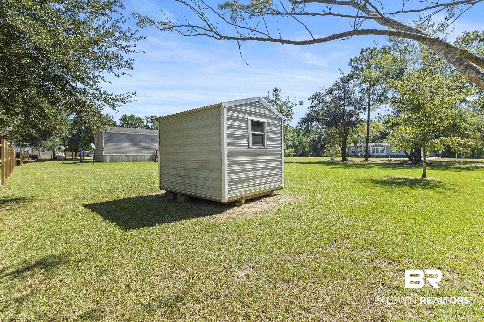 6870 Cecilia Court Theodore, AL 36582 - Photo 57 of 83 View of yard featuring a storage unit