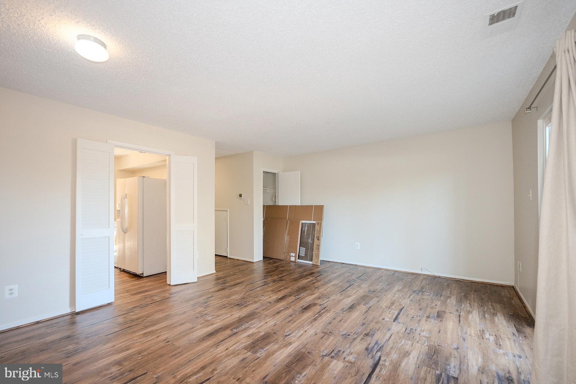 2202 Southgate Square Reston, VA 20191 - Photo 13 of 26 an empty room with wooden floor and closet