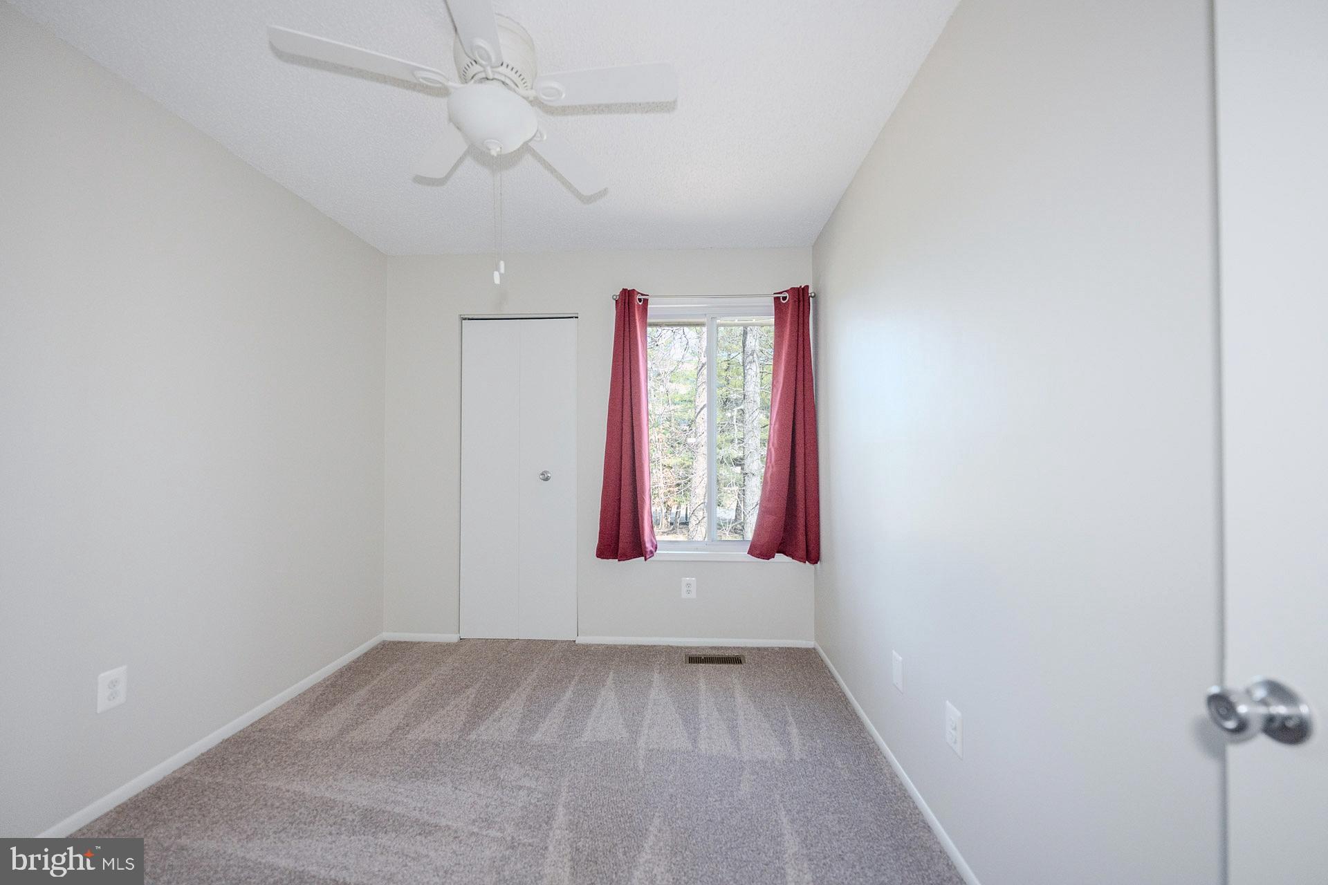 2202 Southgate Square Reston, VA 20191 - Photo 16 of 26 an empty room with windows and closet