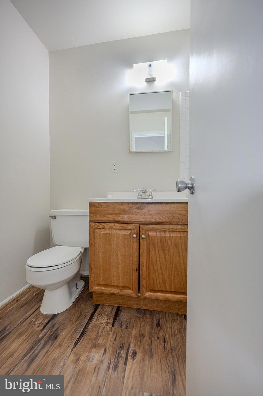 2202 Southgate Square Reston, VA 20191 - Photo 23 of 26 a bathroom with a toilet a sink and mirror