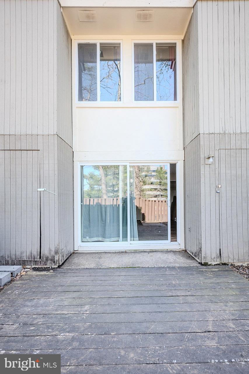 2202 Southgate Square Reston, VA 20191 - Photo 26 of 26 an empty room with wooden floor and windows