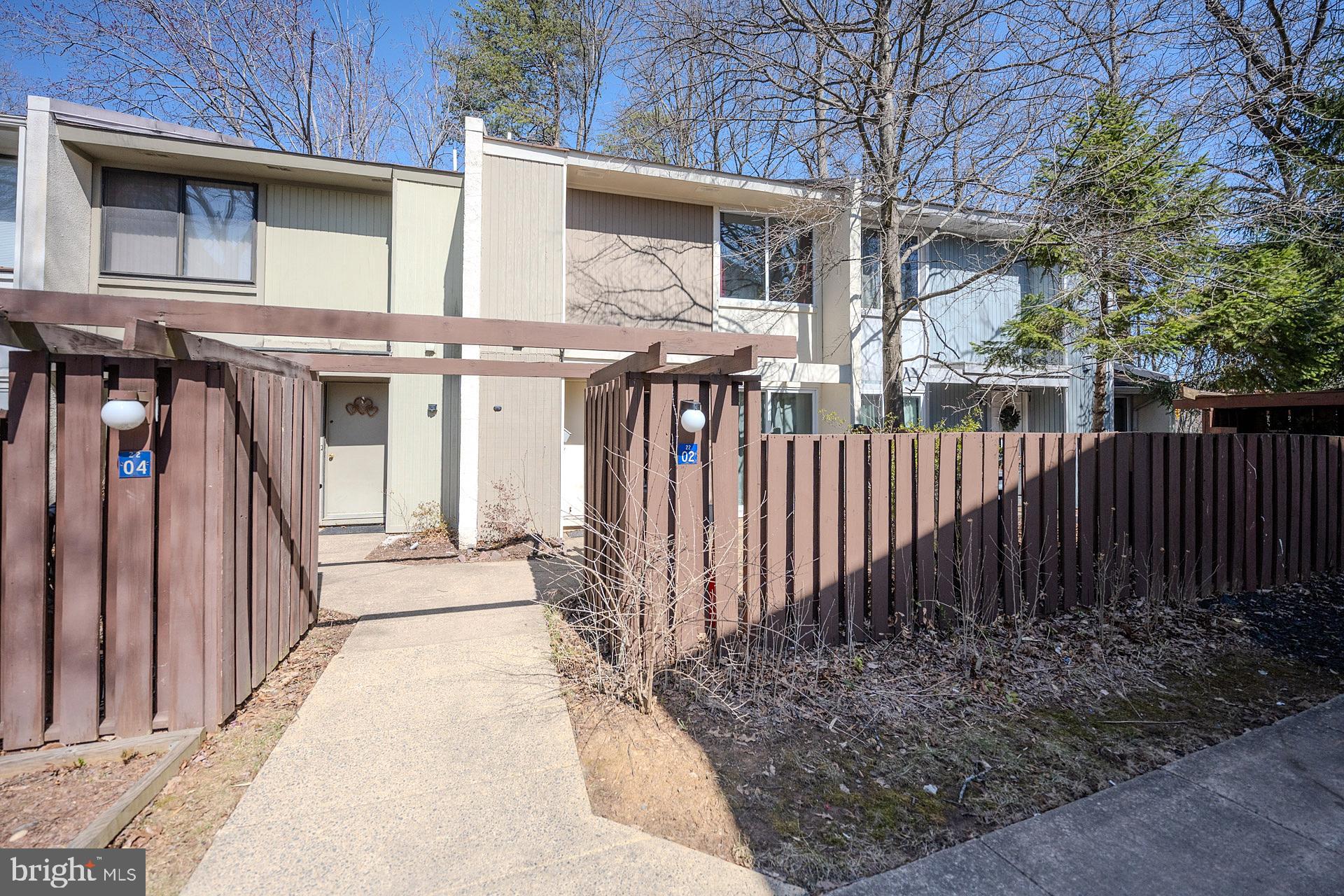 2202 Southgate Square Reston, VA 20191 - Photo 4 of 26 a view of a house with wooden fence