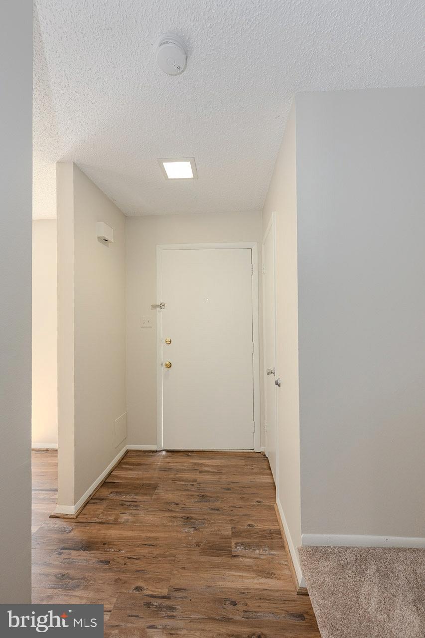 2202 Southgate Square Reston, VA 20191 - Photo 8 of 26 wooden floor in an empty room