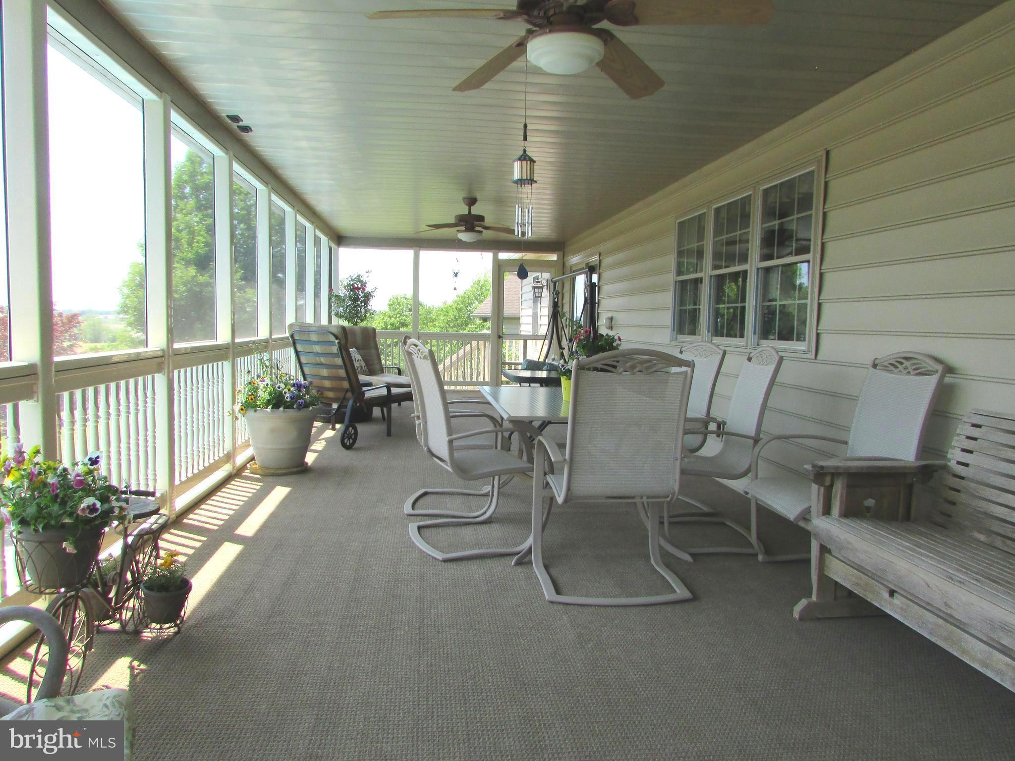 1400 Mentzer Road Lancaster, PA 17602 - Photo 22 of 45 Lovely Screened Porch overlooking backyard and poo