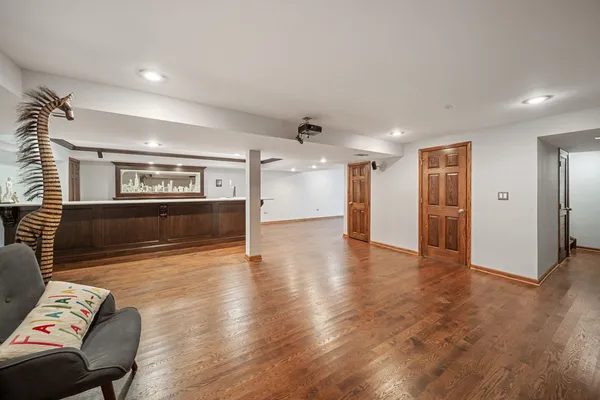 a view of a large room with wooden floor and lots of counter top space
