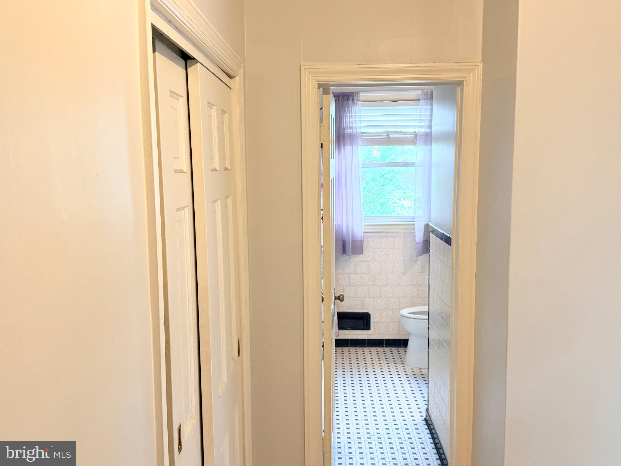 1615 Burnwood Road Baltimore, MD 21239 - Photo 21 of 83 Bright hallway leading to a serene bath.