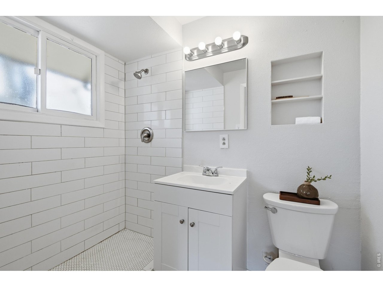 11590 West 39th Place Wheat Ridge, CO 80033 - Photo 14 of 37 a bathroom with a sink toilet and vanity