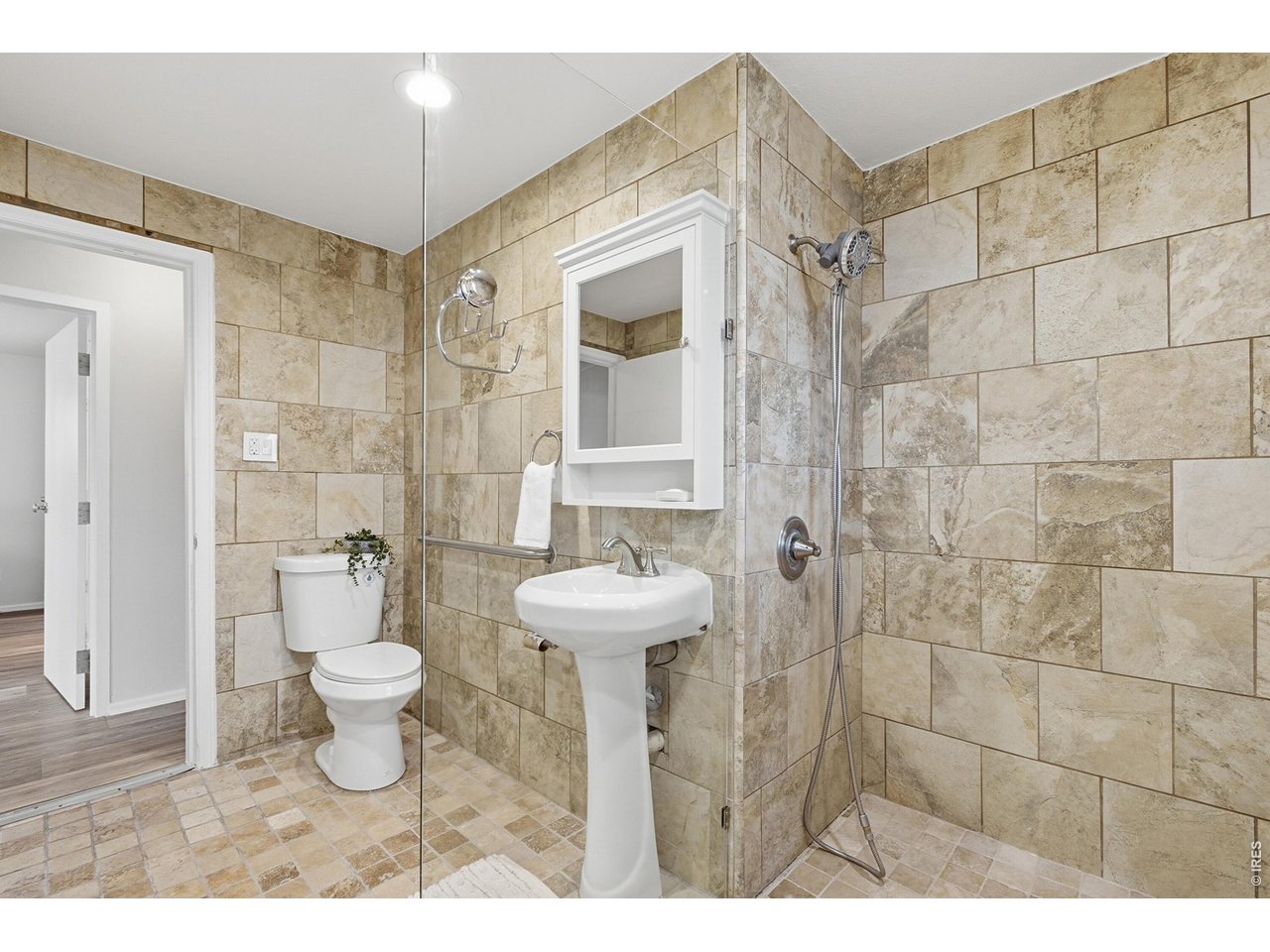 11590 West 39th Place Wheat Ridge, CO 80033 - Photo 20 of 37 a bathroom with a sink toilet and shower
