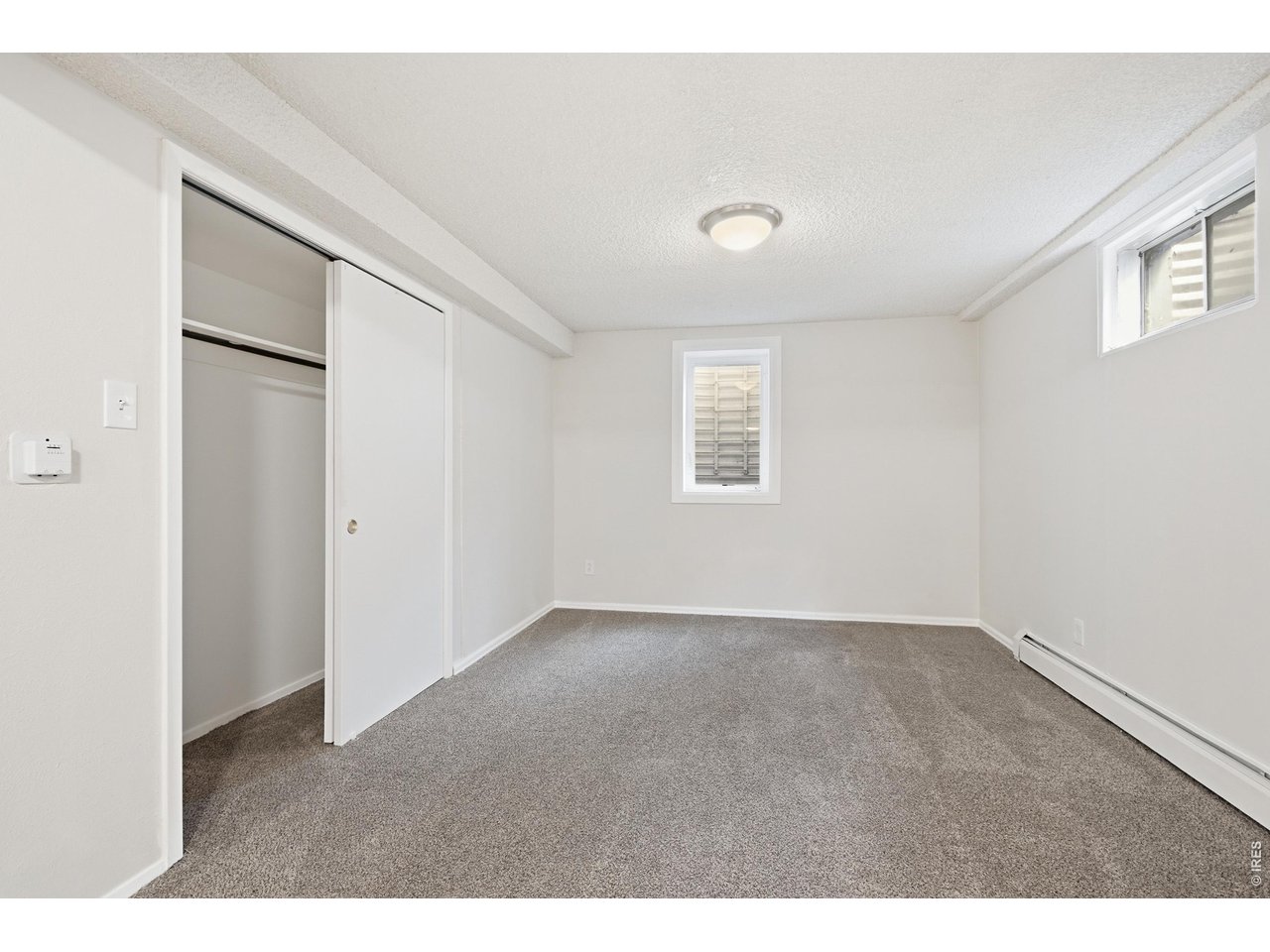 11590 West 39th Place Wheat Ridge, CO 80033 - Photo 21 of 37 a view of an empty room with a window