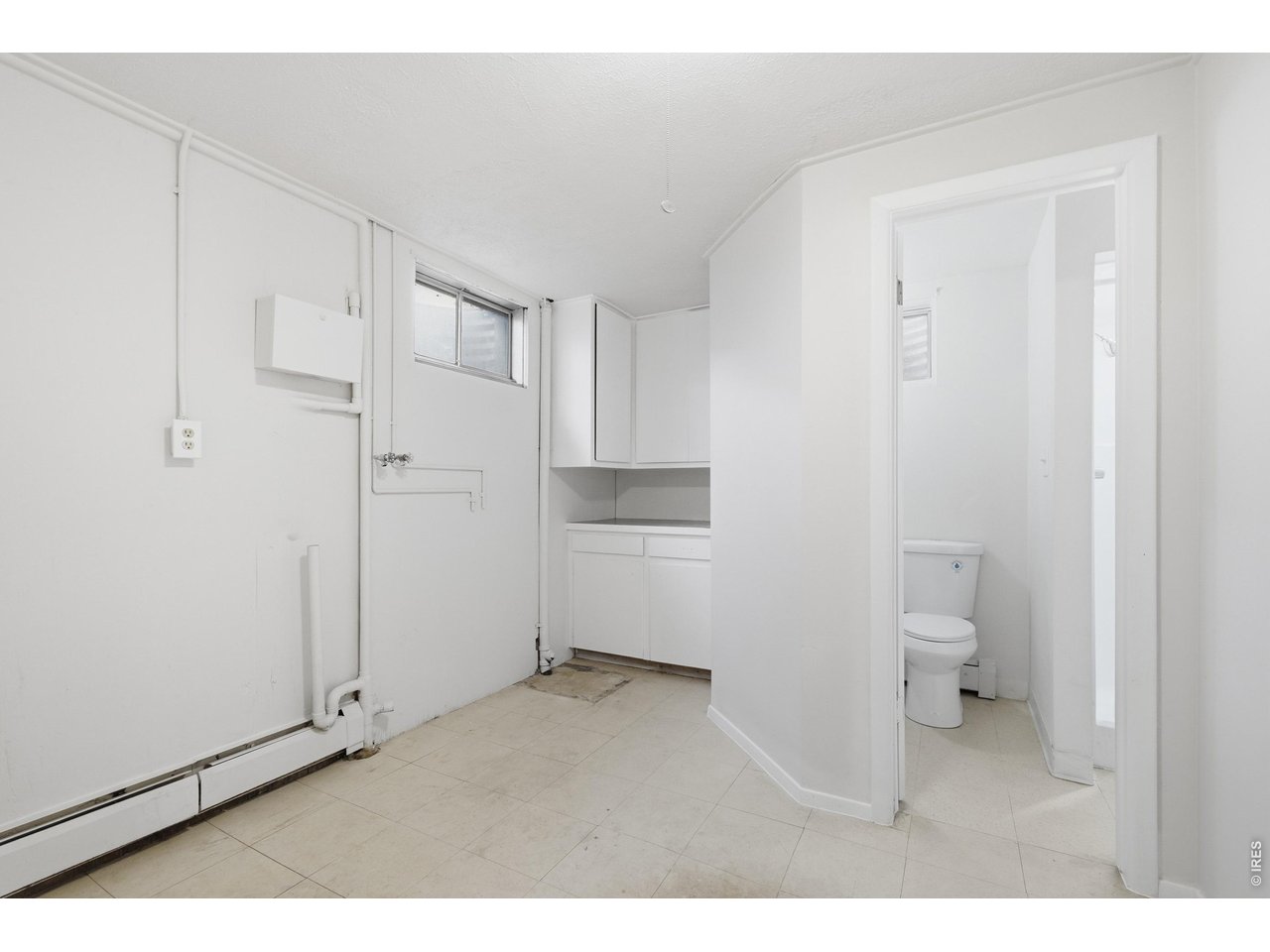11590 West 39th Place Wheat Ridge, CO 80033 - Photo 23 of 37 a bathroom with a toilet