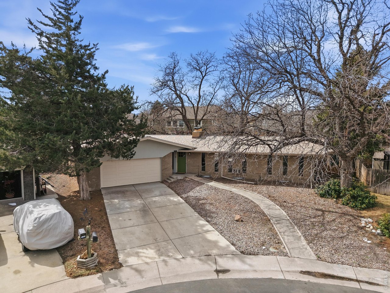 11590 West 39th Place Wheat Ridge, CO 80033 - Photo 24 of 37 a front view of a house with parking space