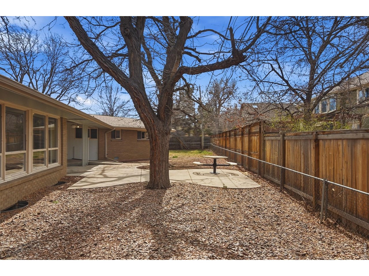 11590 West 39th Place Wheat Ridge, CO 80033 - Photo 27 of 37 a house with trees in front of it
