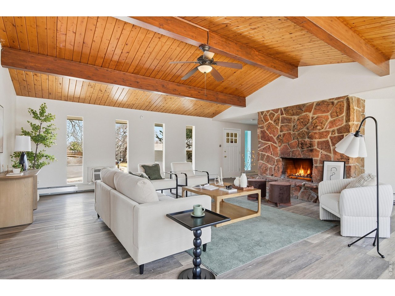11590 West 39th Place Wheat Ridge, CO 80033 - Photo 5 of 37 a living room with furniture a fireplace and a table