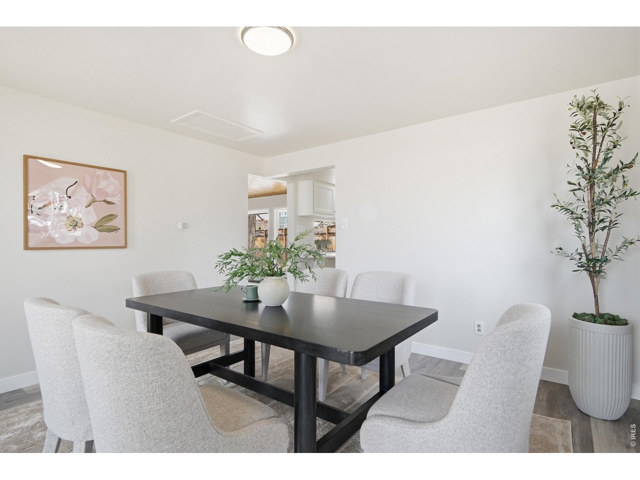 11590 West 39th Place Wheat Ridge, CO 80033 - Photo 7 of 37 a dining room with furniture and wooden floor