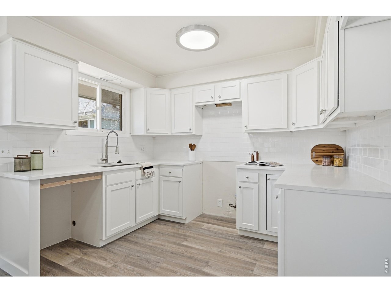 11590 West 39th Place Wheat Ridge, CO 80033 - Photo 8 of 37 a kitchen with cabinets stainless steel appliances and a sink