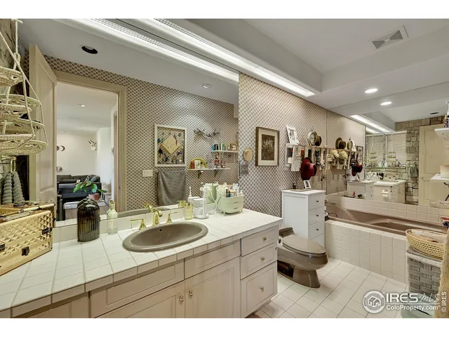 a bathroom with a sink double vanity and a mirror
